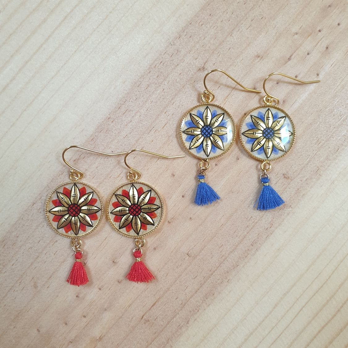 Brincos de ouro/azul com gota de flor