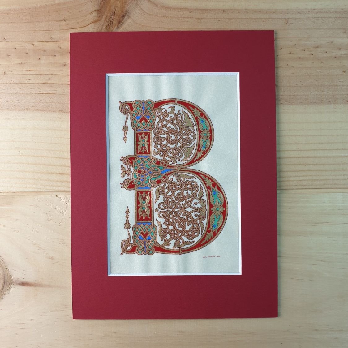 Letra B iluminada em estilo carolíngio