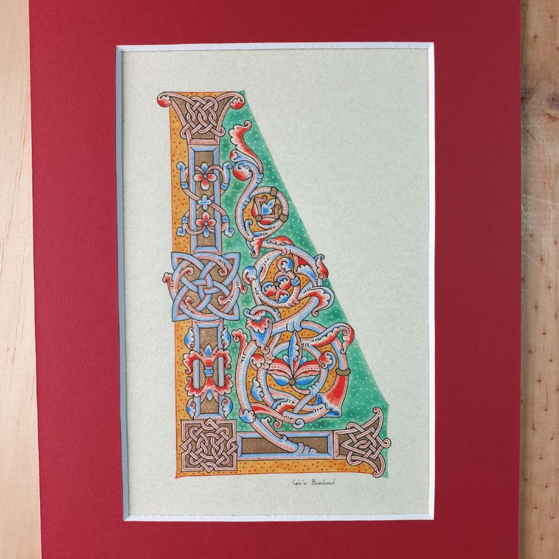 Letra L iluminada em estilo românico