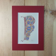 Letra P iluminada em estilo românico